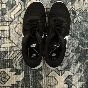 Black and white Nike tennis shoes